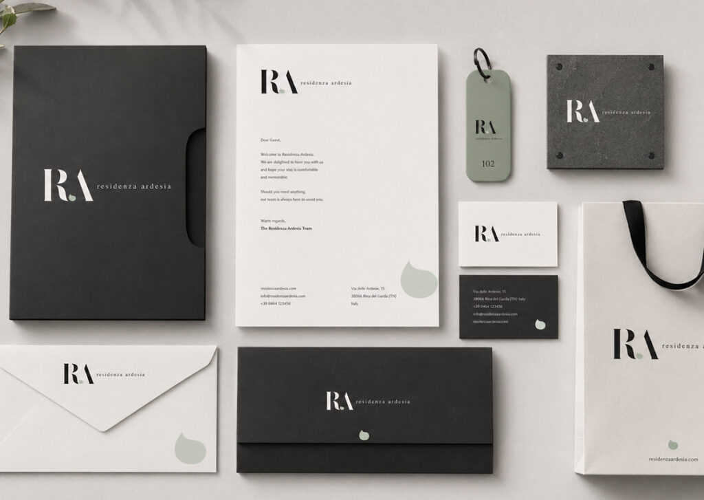 Brand identity immobiliare Residenza Ardesia Genova con logo RA e palette coordinata